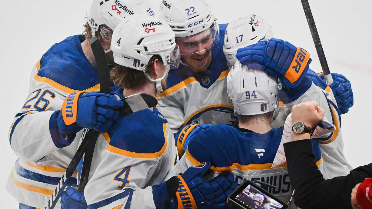 Buffalo Sabres' Konsta Helenius (94) celebrates with teammates after scoring against the Montreal Canadiens during the second period of Game 6 in a second-round NHL hockey Stanley Cup playoff series in Montreal, Saturday, May 16, 2026.