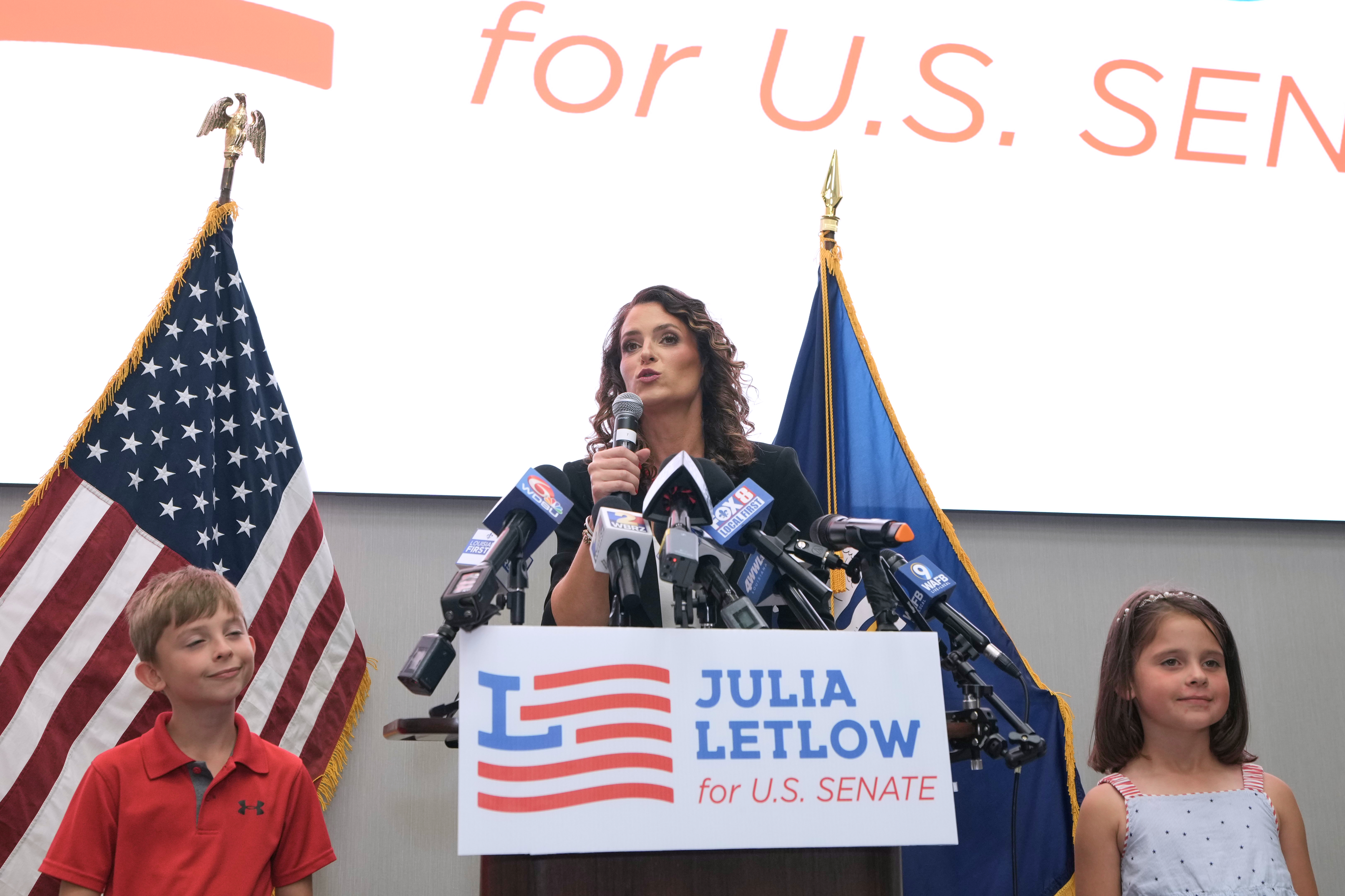Senate candidate Rep. Julia Letlow, R-La., speaks to supporters alongside her two children, Jeremiah and Jacqueline, during an election night watch party Saturday, in Baton Rouge, La. Incumbent Sen. Bill Cassidy finished third in the primary.