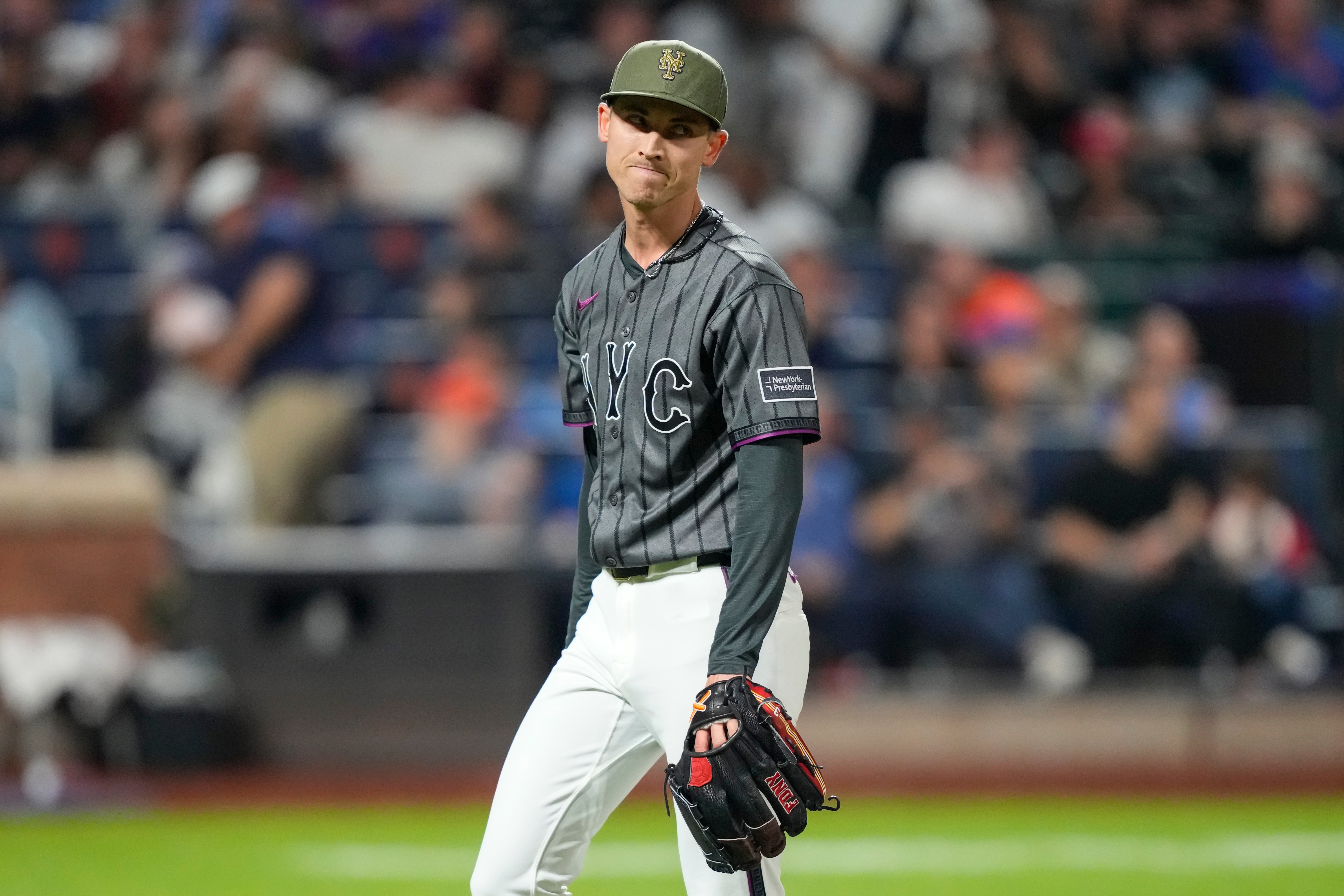 Weaver's fib: Tells injured Holmes he had name written in cap because `it just felt right to say'