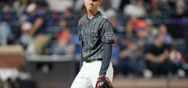 Weaver's fib: Tells injured Holmes he had name written in cap because `it just felt right to say'