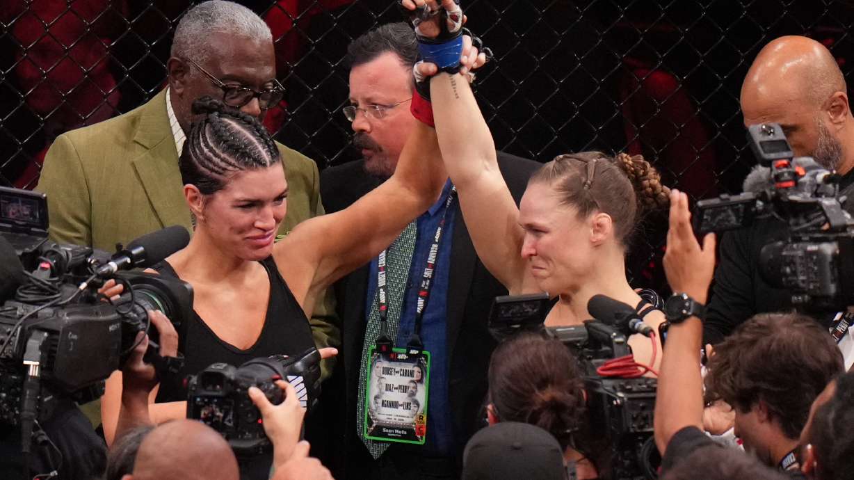 Ronda Rousey, of the United States, right, celebrates after defeating Gina Carano, of the United States, left, in their featherweight mixed martial arts fight Saturday, May 16, 2026, in Inglewood, Calif.
