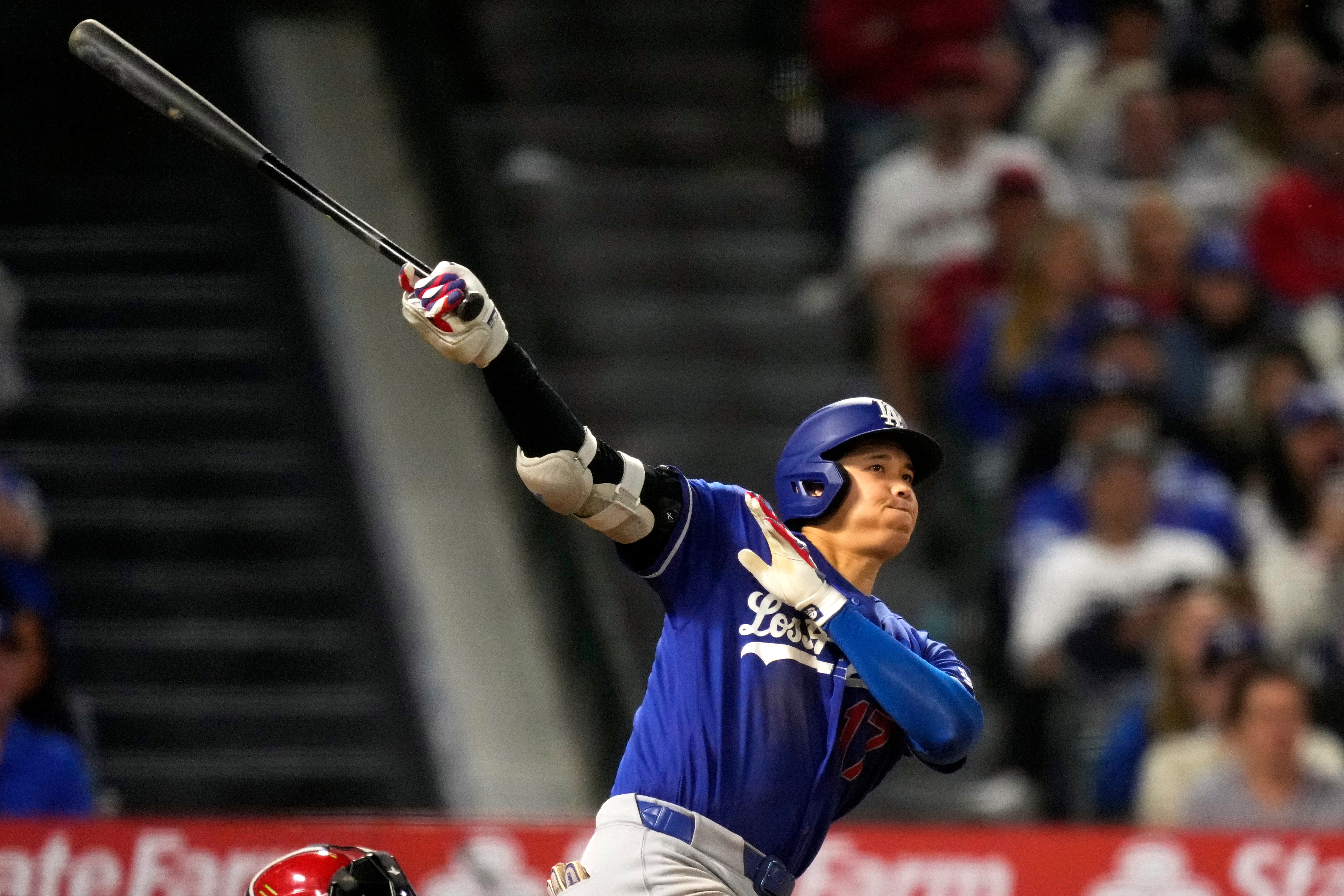 Los Angeles Dodgers' Shohei Ohtani hits a two-run triple during the eighth inning of a baseball game against the Los Angeles Angels, Saturday, May 16, 2026, in Anaheim, Calif.  CORRECTION: After official review, changed from three-run inside-the-park home run to two-run triple after a throwing error