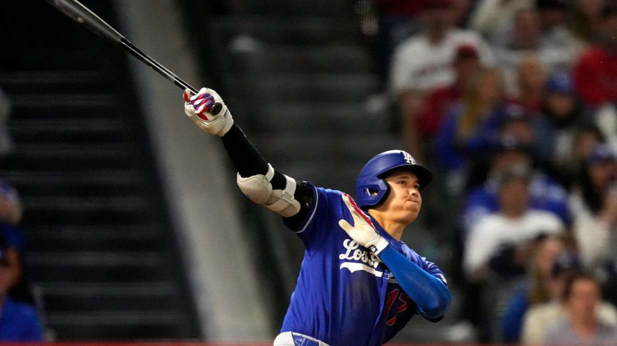 Los Angeles Dodgers' Shohei Ohtani hits a two-run triple during the eighth inning of a baseball game against the Los Angeles Angels, Saturday, May 16, 2026, in Anaheim, Calif. CORRECTION: After official review, changed from three-run inside-the-park home run to two-run triple after a throwing error