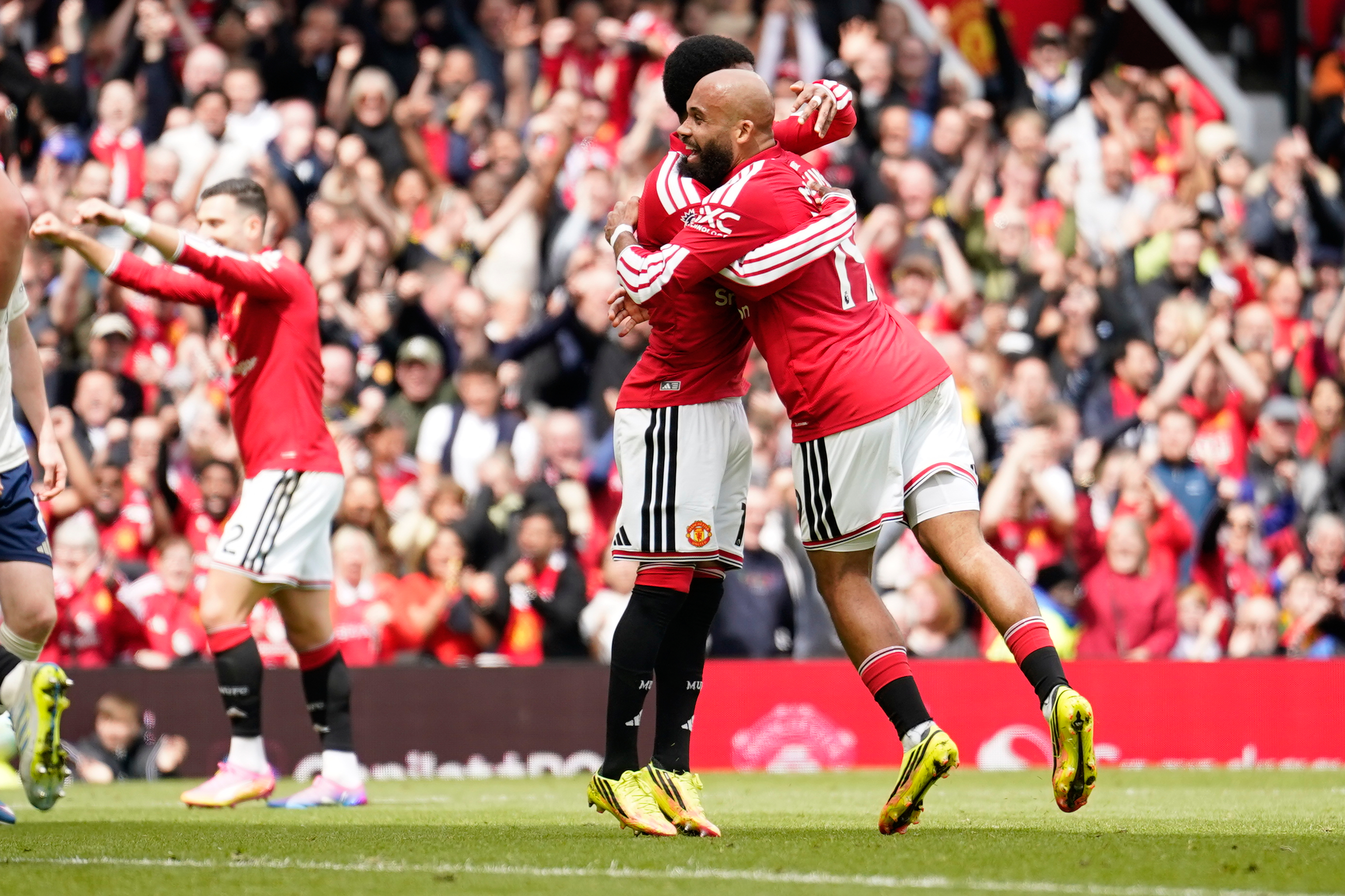 Manchester United's Bryan Mbeumo, right, celebrates after scoring his side's third goal during the English Premier League soccer match between Manchester United and Nottingham Forest in Manchester, England, Sunday, May 17, 2026.