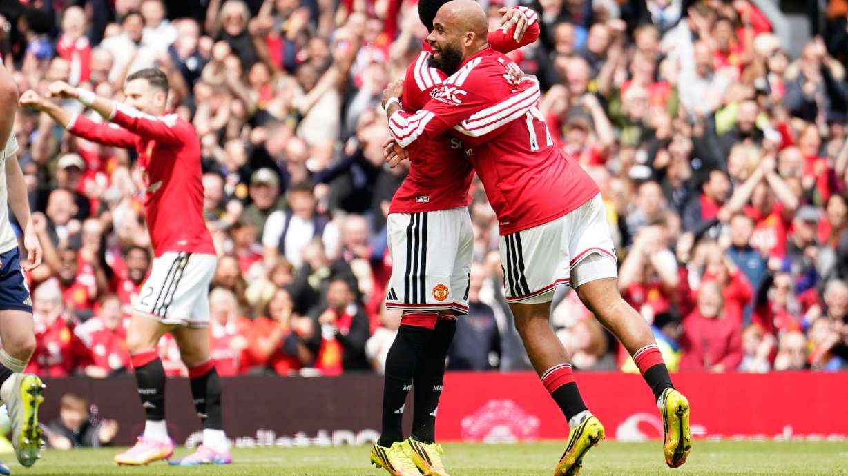 Manchester United's Bryan Mbeumo, right, celebrates after scoring his side's third goal during the English Premier League soccer match between Manchester United and Nottingham Forest in Manchester, England, Sunday, May 17, 2026.