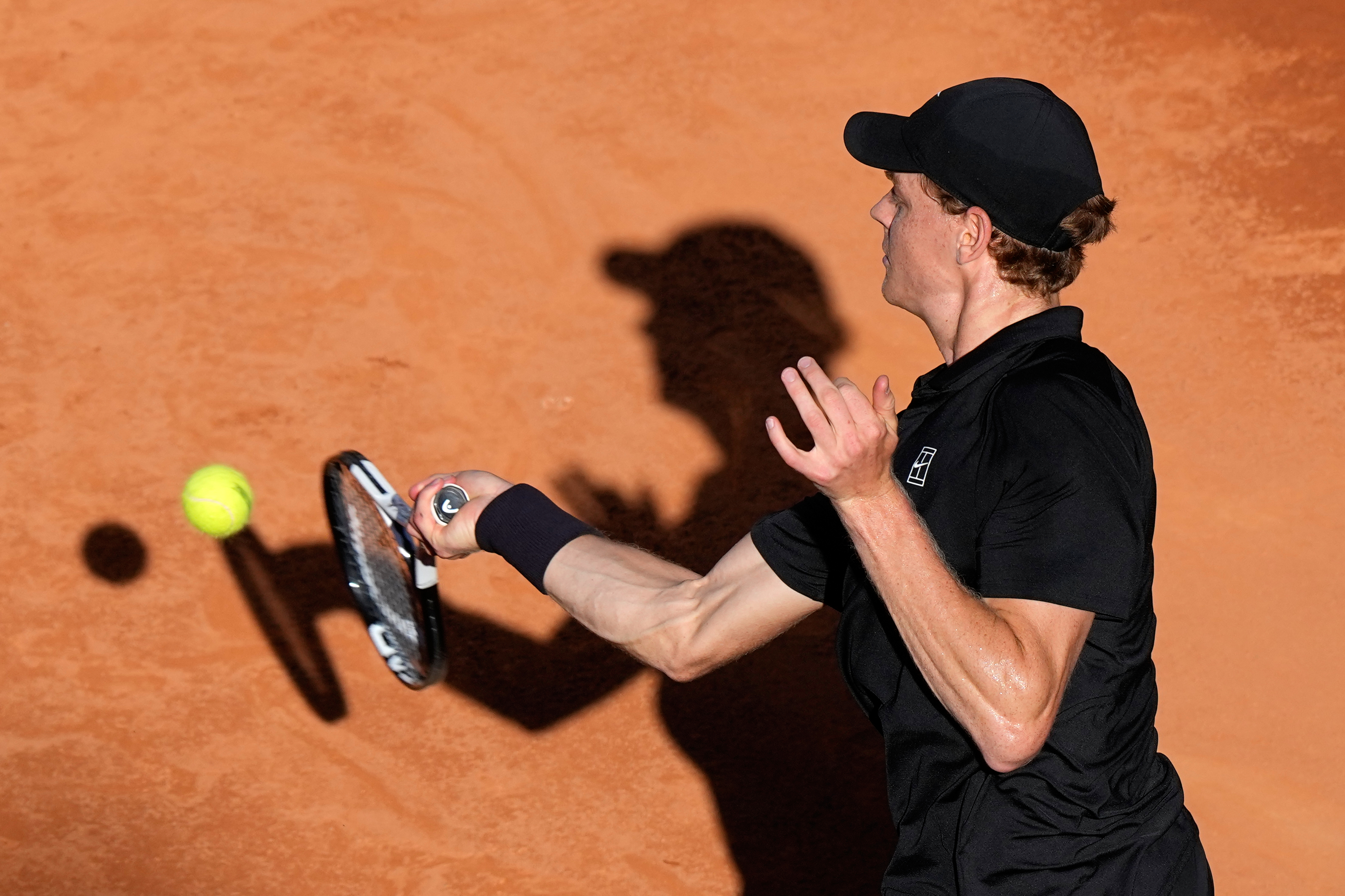 Jannik Sinner, of Italy, returns the ball to Casper Ruud, of Norway, during the final match at the Italian Open tennis tournament, in Rome, Sunday, May 17, 2026. 