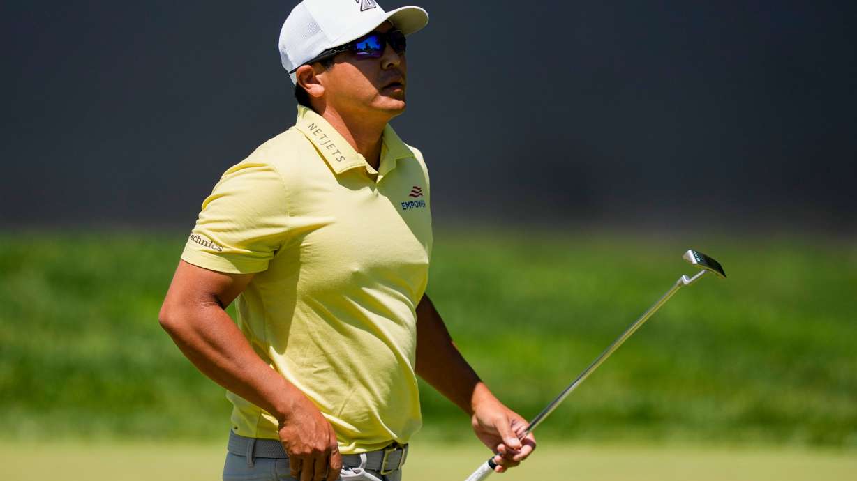 Kurt Kitayama walks across the first green after his shot during the third round of the PGA Championship golf tournament at Aronimink Golf Club, Saturday, May 16, 2026, in Newtown Square, PA.