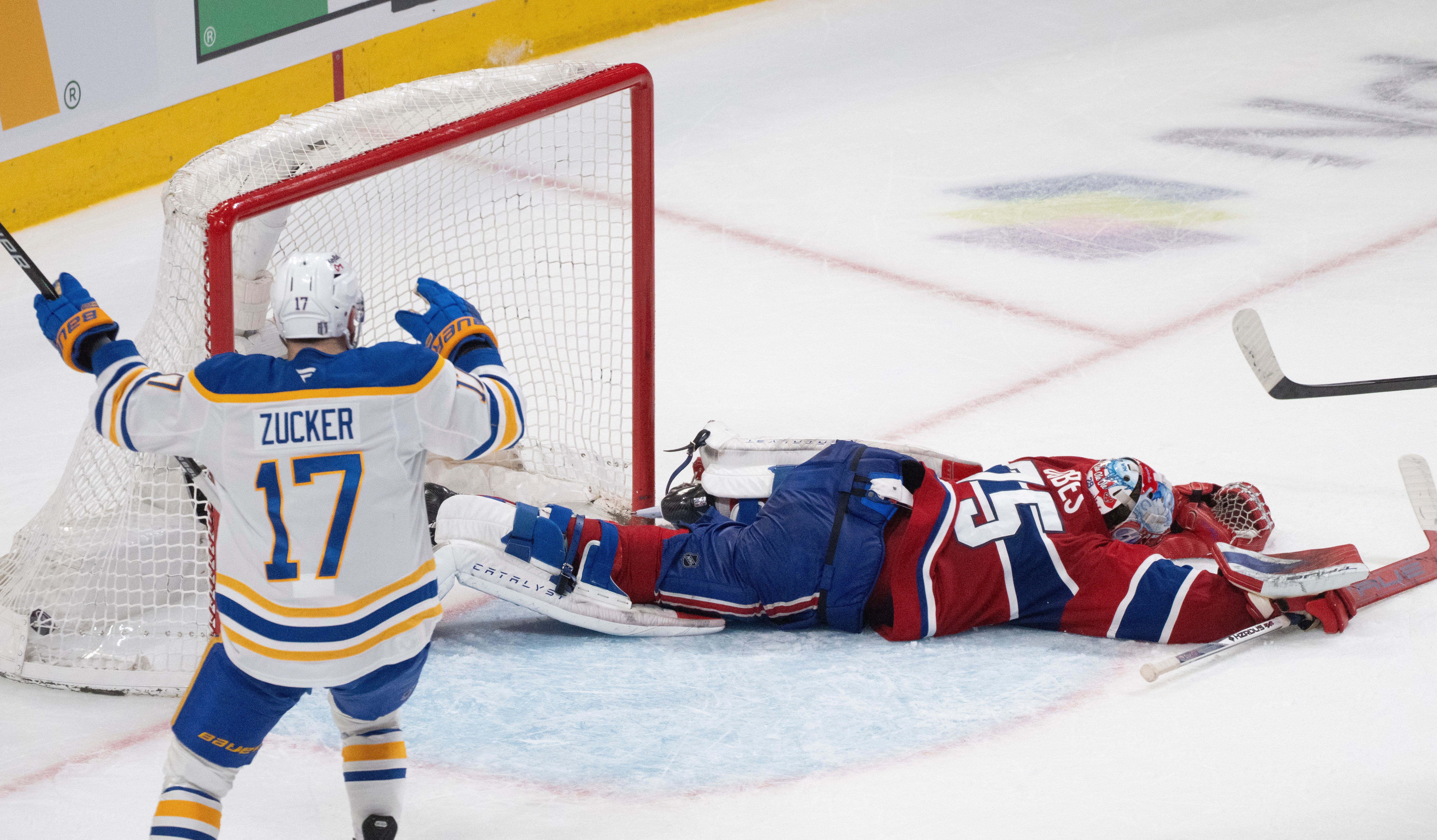 Buffalo Sabres' Jason Zucker (17) celebrates a goal by teammate Konsta Helenius in front of Montreal Canadiens goaltender Jakub Dobes (75) during the second period in Game 6 in a second-round NHL hockey Stanley Cup playoff series in Montreal, Saturday, May 16, 2026. 