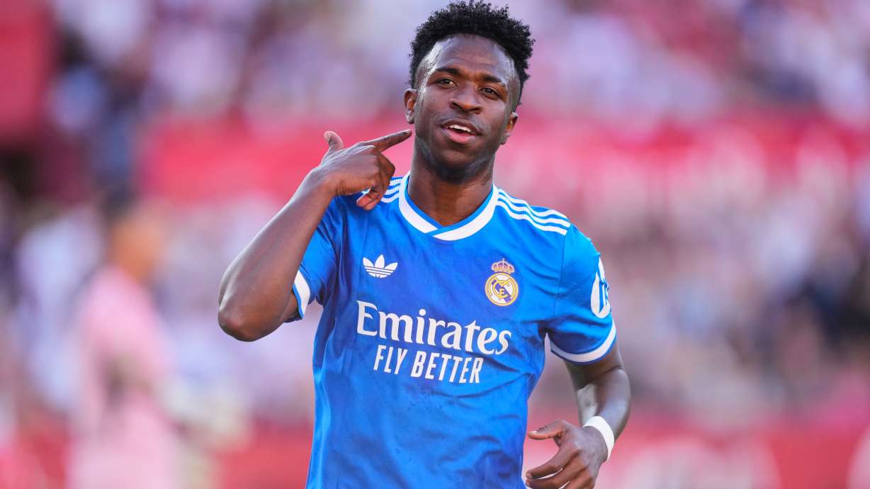 Real Madrid's Vinicius Junior celebrates after scoring the opening goal during the Spanish La Liga soccer match between Real Madrid and Sevilla in Seville, Spain, Sunday, May 17, 2026.