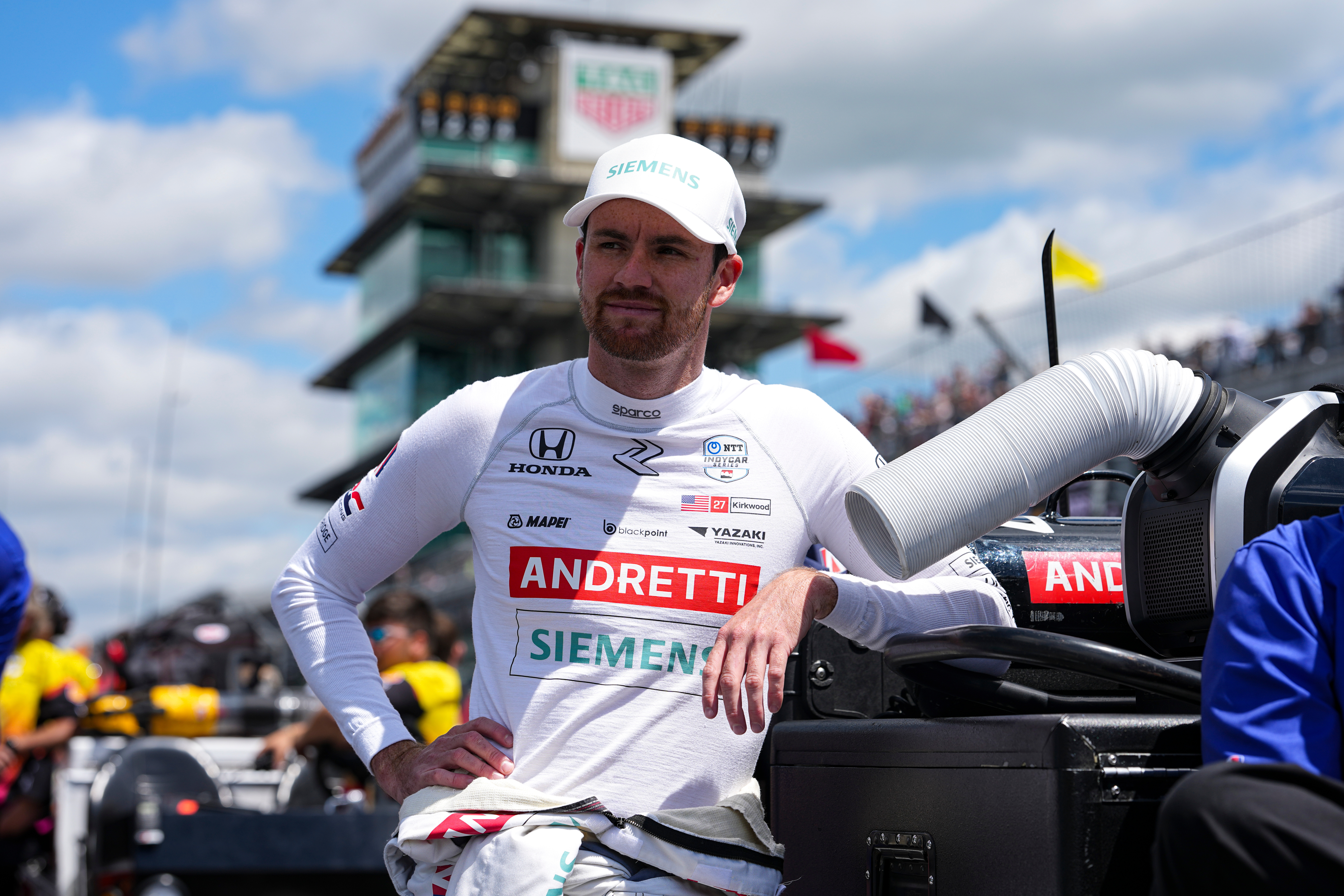 FILE - Kyle Kirkwood leans on a tool box as he waits for is turn during qualification for the Indianapolis 500 auto race at Indianapolis Motor Speedway in Indianapolis, May 17, 2025.