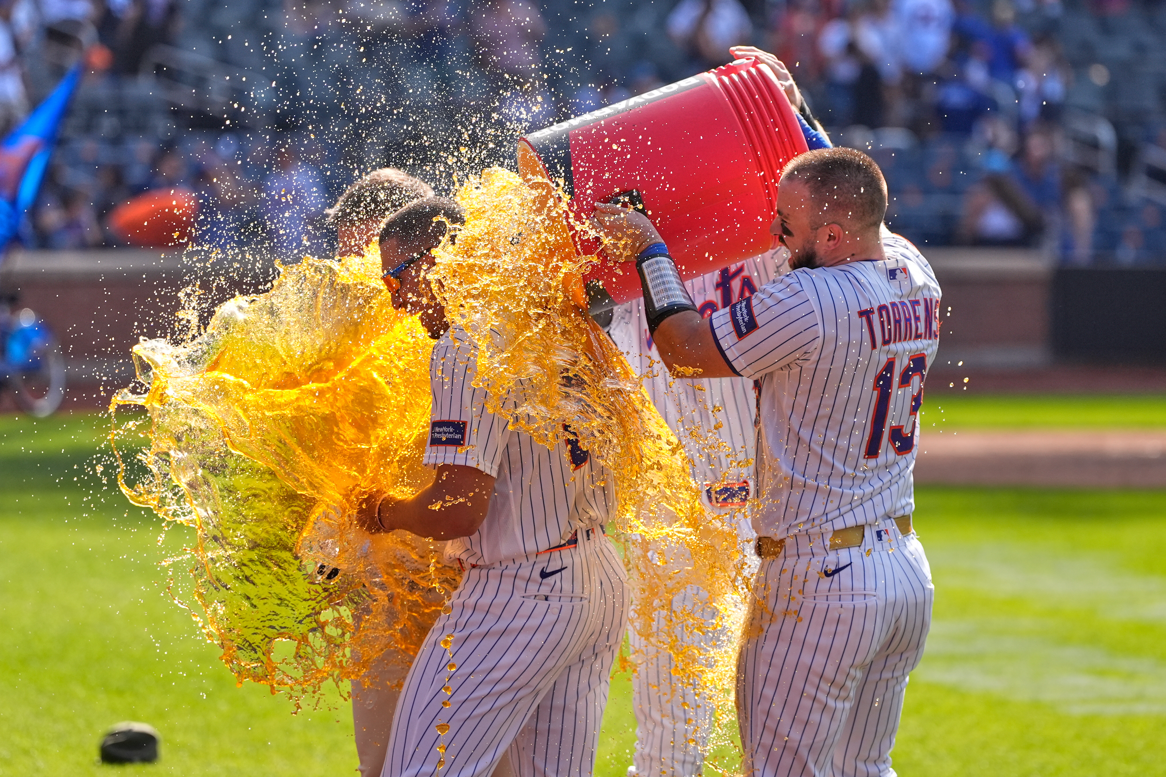 New York Mets' players dump a cooler on Tyrone Taylor, left, after a baseball game against the New York Yankees, Sunday, May 17, 2026, in New York. 