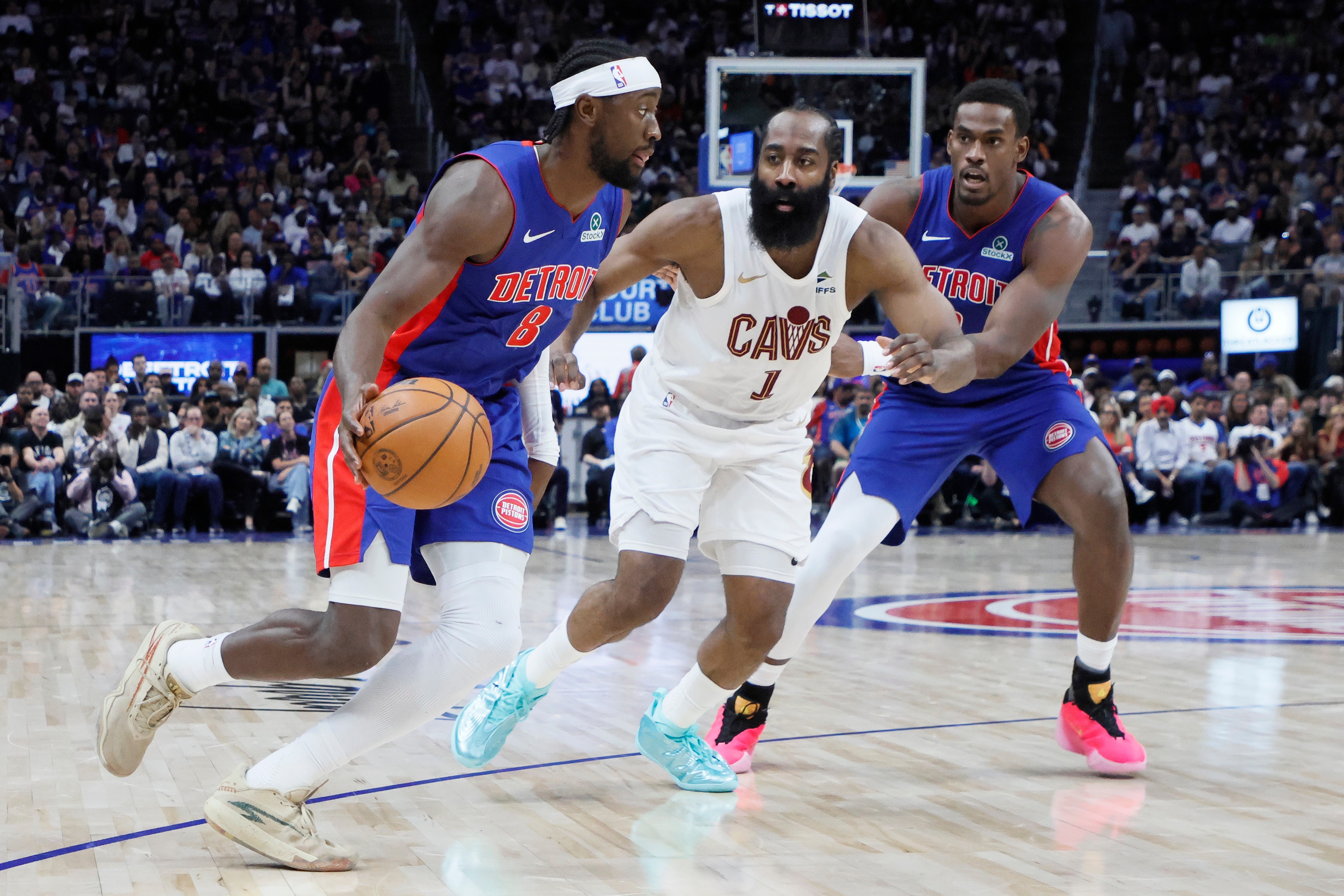 Detroit Pistons guard Caris LeVert (8) drives to the basket against Cleveland Cavaliers guard James Harden (1) with Pistons center Jalen Duren, right, helping on the play during the first half in Game 7 of a second-round NBA playoffs basketball series Sunday, May 17, 2026, in Detroit. 
