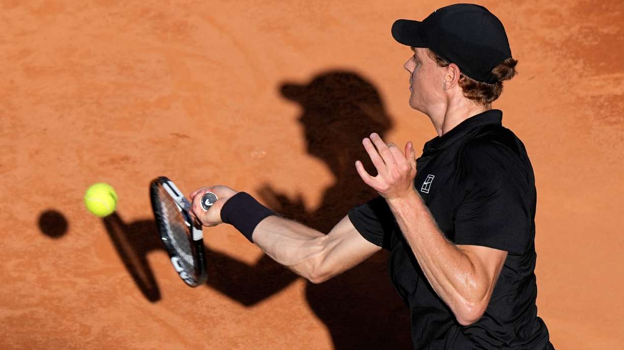 Jannik Sinner, of Italy, returns the ball to Casper Ruud, of Norway, during the final match at the Italian Open tennis tournament, in Rome, Sunday, May 17, 2026.