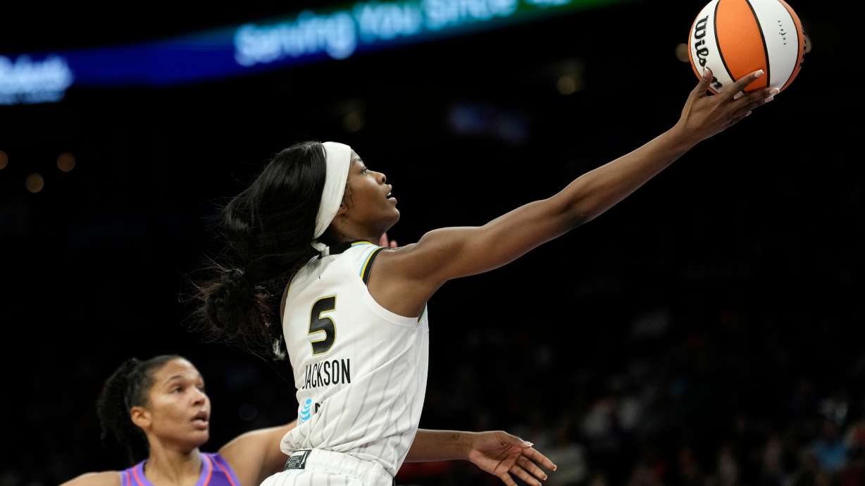 Chicago Sky forward Rickea Jackson (5) drives past Phoenix Mercury forward Alyssa Thomas to score during the second half of a WNBA basketball game, Friday, May 15, 2026, in Phoenix.
