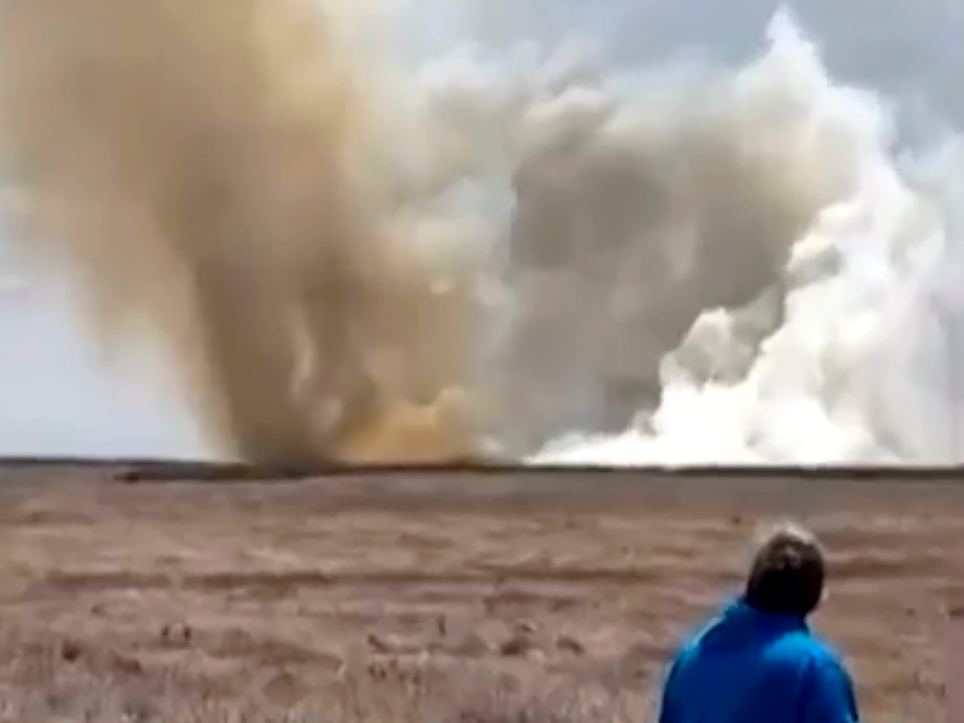 A plume of smoke rises above a plain near Mountain Home Air Force Base, Idaho, where two Navy jets collided at an air show on Sunday.