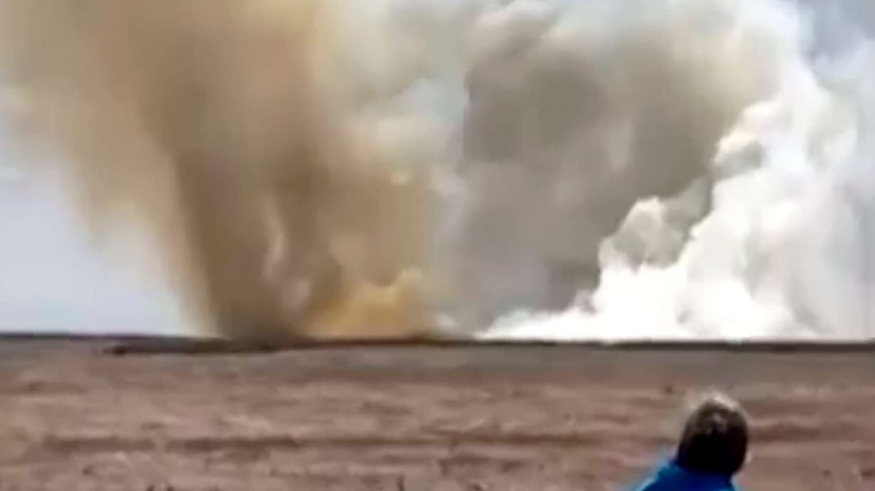 A plume of smoke rises above a plain near Mountain Home Air Force Base, Idaho, where two Navy jets collided at an air show on Sunday.