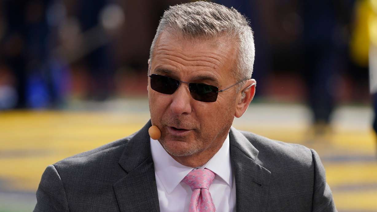 FILE - Urban Meyer, a FOX Sports college football analyst, appears before an NCAA college football game between Michigan and Penn State in Ann Arbor, Mich., Oct. 15, 2022.