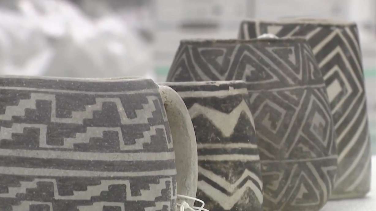 Indigenous mugs are lined up inside Utah's Natural History Museum, after the museum worked with the Bureau of Land Management to recover them and 100,000 artifacts like them, as a result of a widespread looting case.