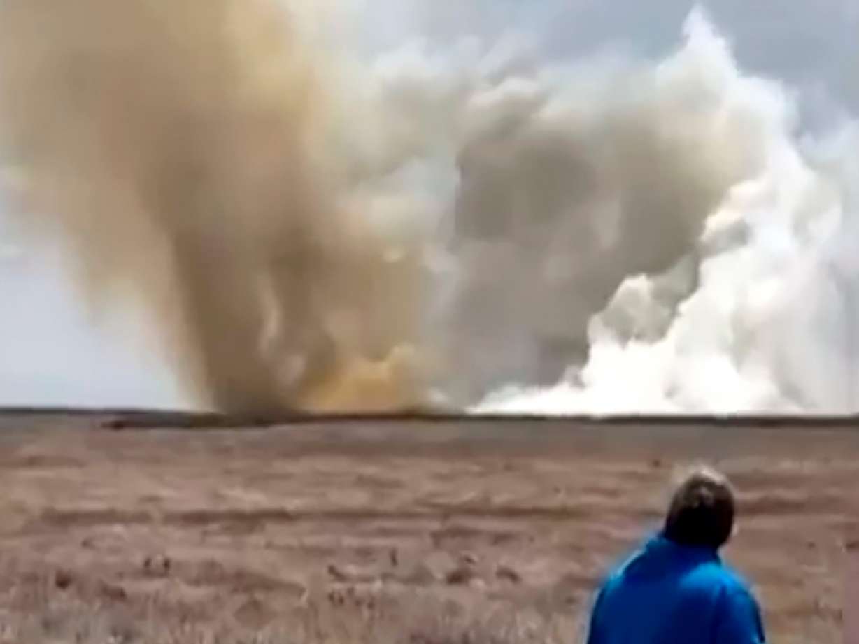 A plume of smoke rises above a plain near Mountain Home Air Force Base, in Idaho, where two Navy jets collided at an air show on Sunday.