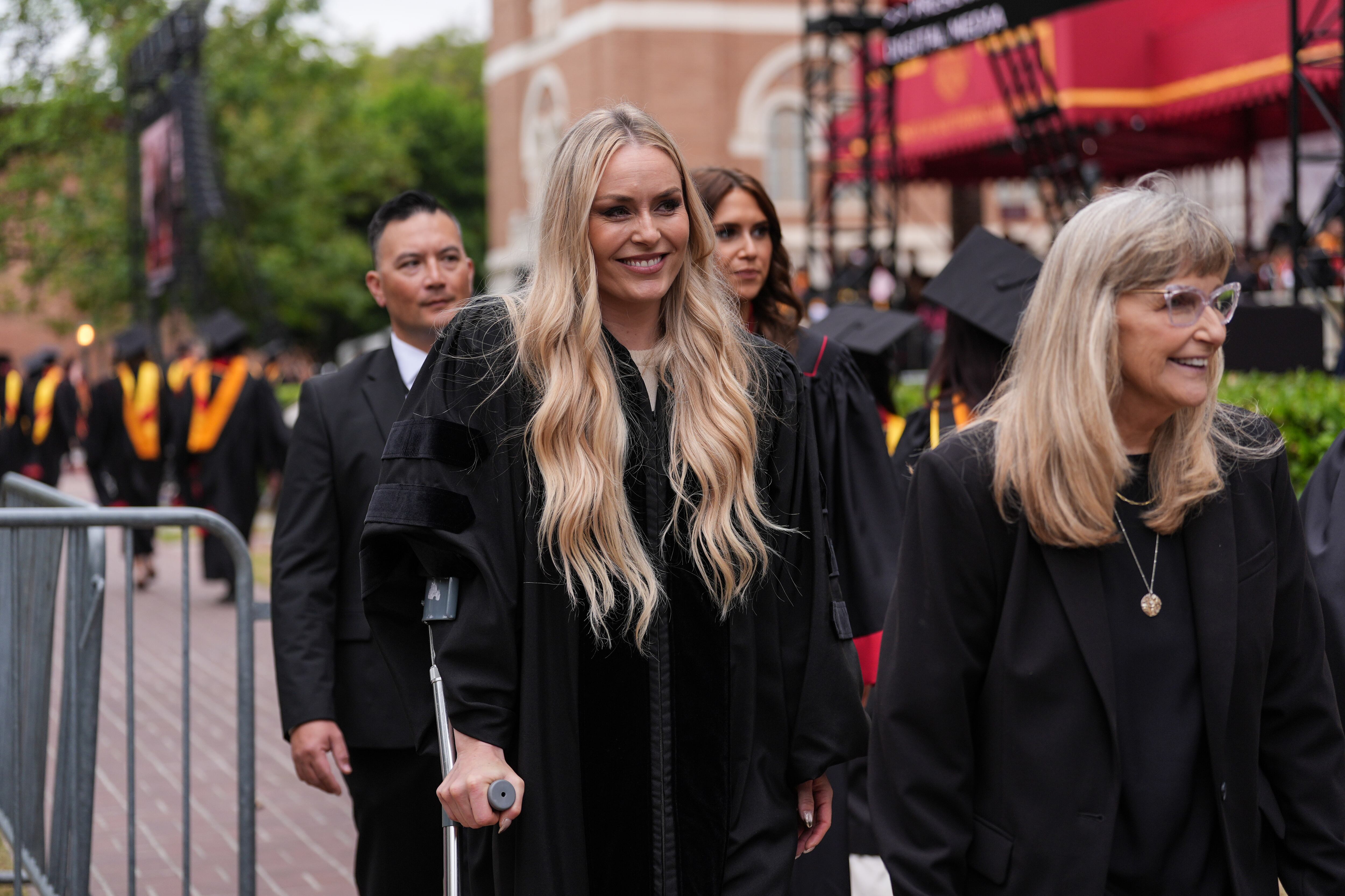 Alpine ski racer Lindsey Vonn leaves walks away on crutches after her commencement address for the University of Southern California's Annenberg School for Communication and Journalism in Los Angeles, Friday.