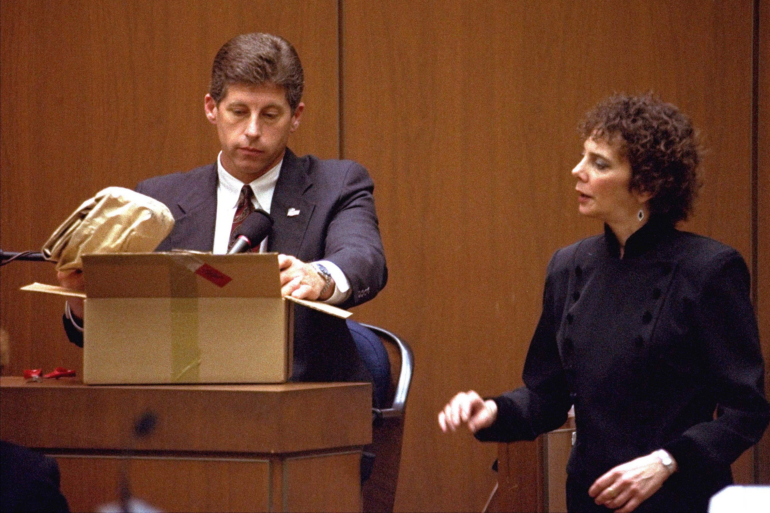 Los Angeles Police Detective Mark Fuhrman shows the jury in the O.J. Simpson double murder trial evidence during testimony March 10, 1995, in Los Angeles. Fuhrman, who was convicted of lying during testimony at the OJ Simpson murder trial, has died. He was 74.
