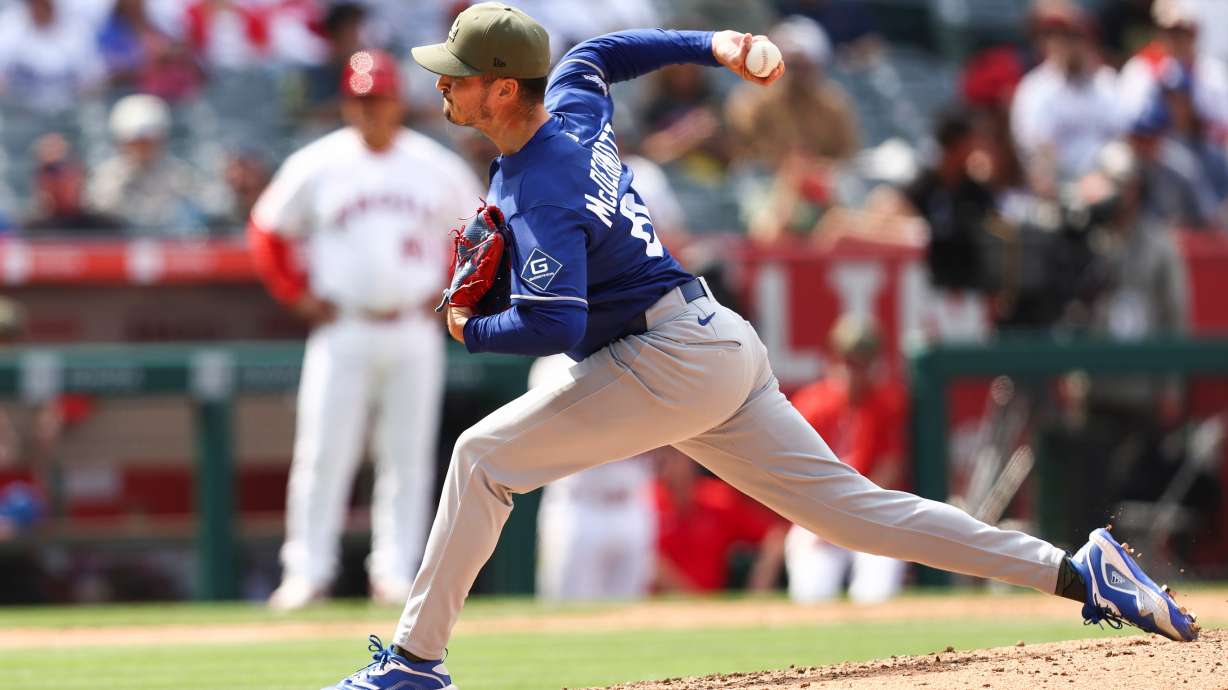 Los Angeles Dodgers pitcher Chayce McDermott throws to a Los Angeles Angels batter during the ninth inning of a baseball game, Sunday, May 17, 2026, in Anaheim, Calif.