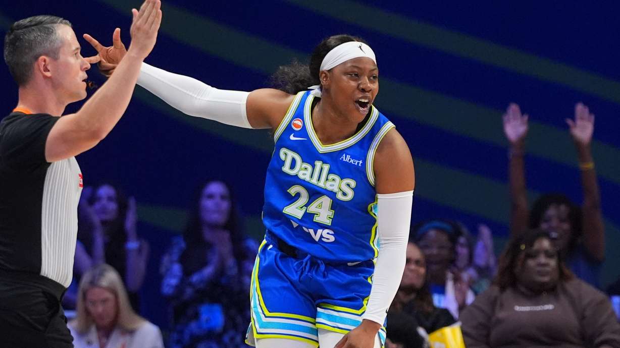 Dallas Wings guard Arike Ogunbowale reacts to scoring a three pointer during the first half of a WNBA basketball game against the Washington Mystics in Arlington, Texas, Monday, May 18, 2026.