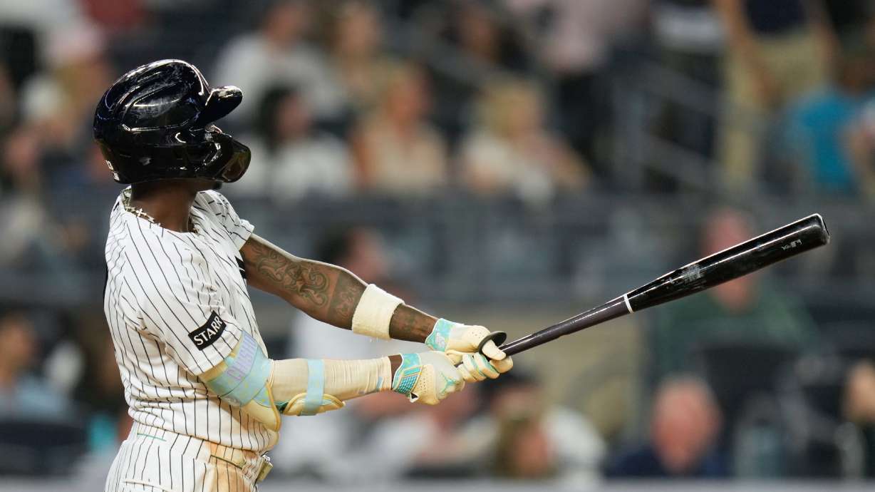 New York Yankees' Jazz Chisholm Jr. looks after his two-run home run during the seventh inning of a baseball game against the Toronto Blue Jays, Monday, May 18, 2026, in New York.