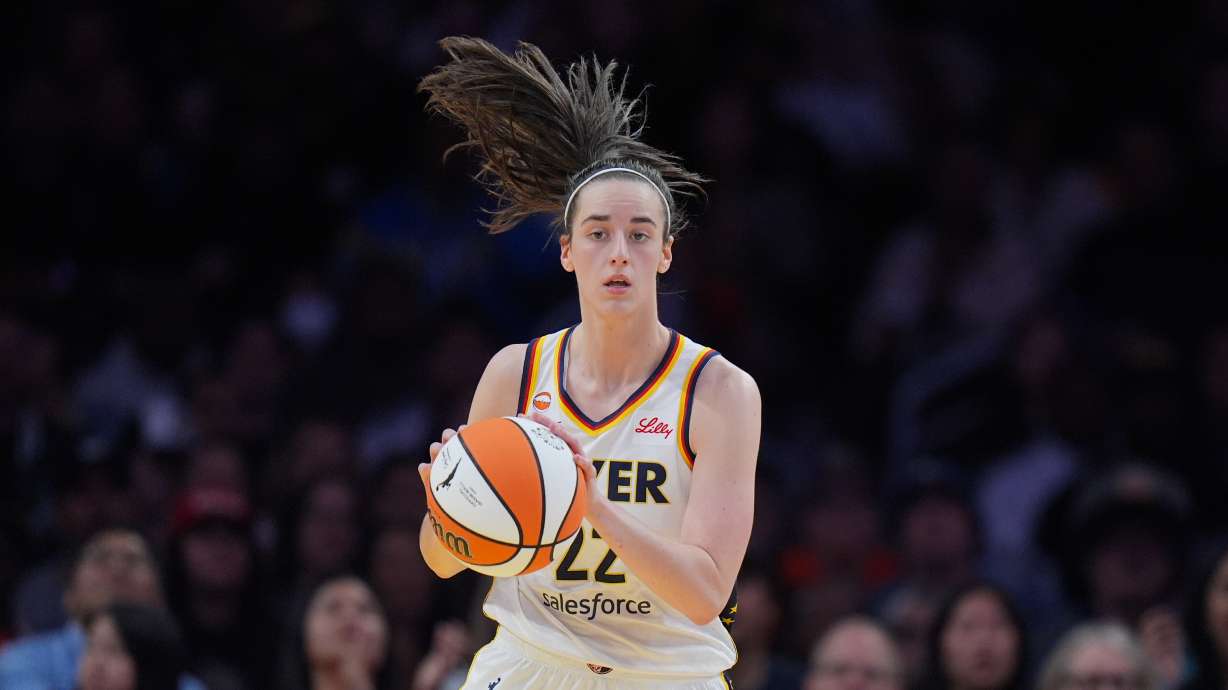 Indiana Fever guard Caitlin Clark (22) dribbles during the first half of a WNBA basketball game against the Los Angeles Sparks Wednesday, May 13, 2026, in Los Angeles.