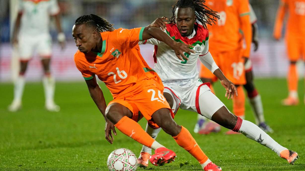 FILE - Ivory Coast's Yan Diomande, left, and Burkina Faso's Issa Kabore challenge during the Africa Cup of Nations best of 16 soccer match between Ivory Coast and Burkina Faso in Marrakech, Morocco, on Jan. 6, 2026.
