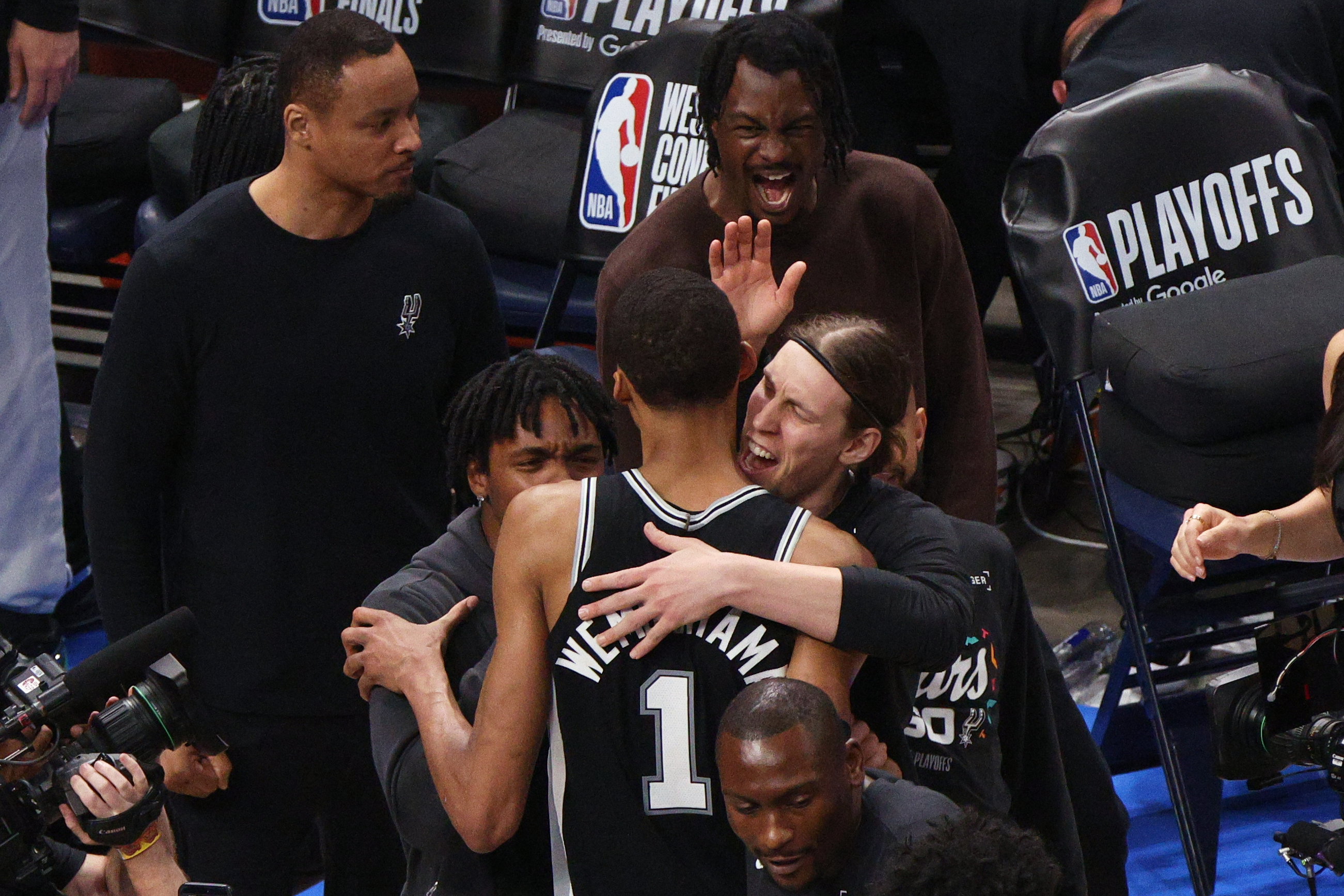 San Antonio Spurs forward Victor Wembanyama (1) celebrates with teammates after winning Game 1 in a third-round NBA basketball playoffs series against the Oklahoma City Thunder Monday, May 18, 2026, in Oklahoma City. 