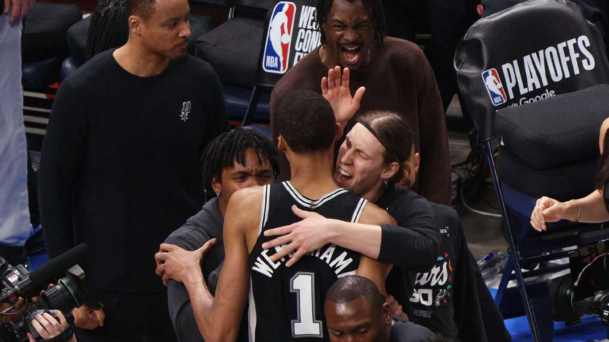 San Antonio Spurs forward Victor Wembanyama (1) celebrates with teammates after winning Game 1 in a third-round NBA basketball playoffs series against the Oklahoma City Thunder Monday, May 18, 2026, in Oklahoma City.
