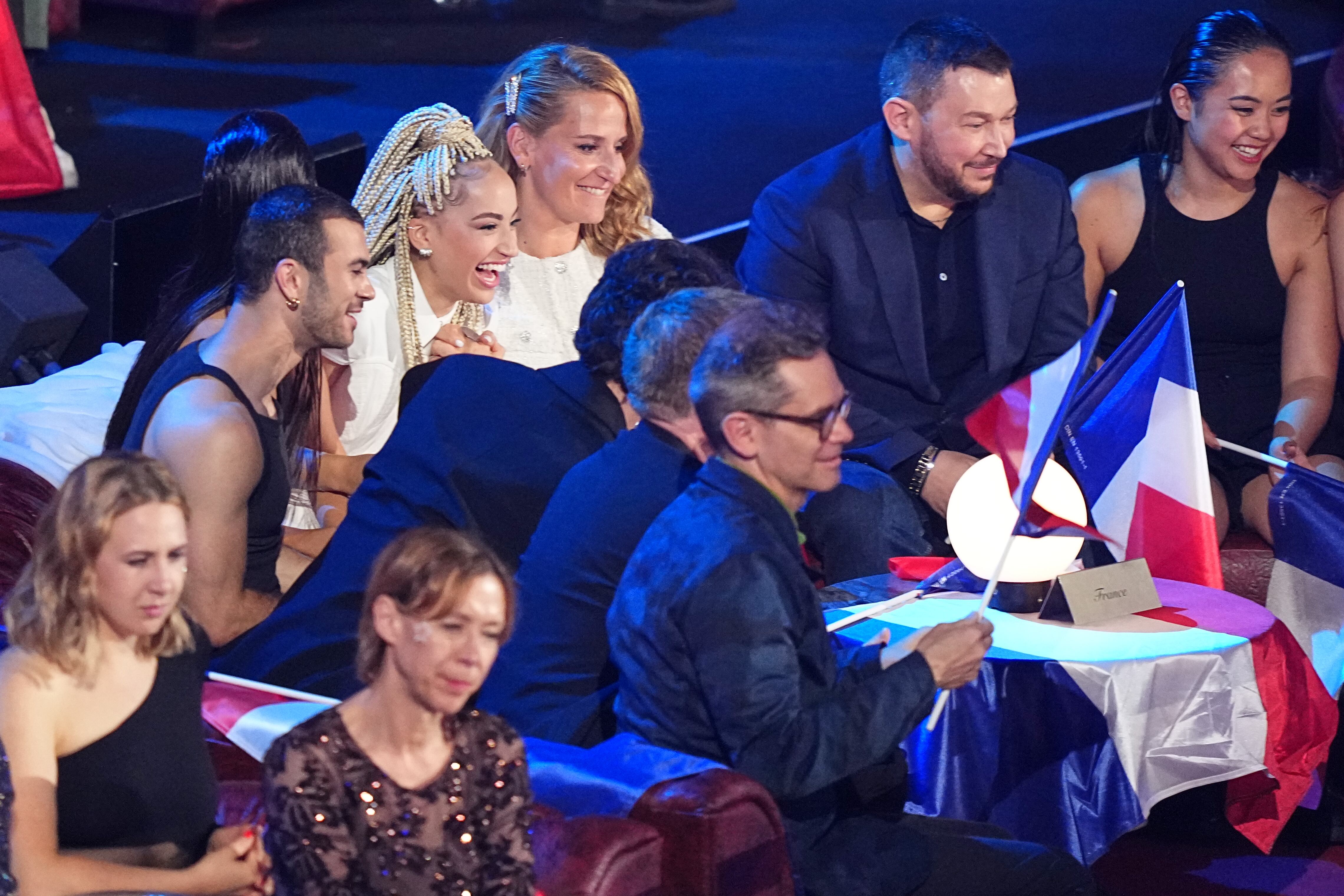 Monroe from France, top second left, reacts as the points are awarded during the Grand Final of the 70th Eurovision Song Contest in Vienna, Austria, Sunday.