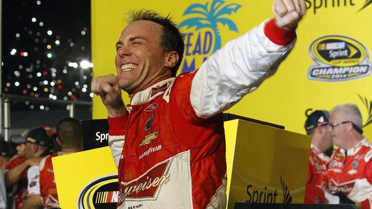 FILE - Kevin Harvick celebrates after winning the NASCAR Sprint Cup championship series auto race, Nov. 16, 2014, in Homestead, Fla.