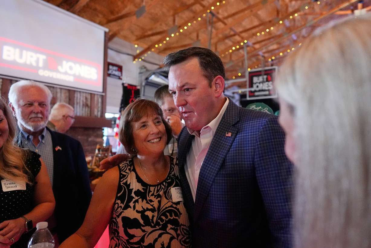 Georgia gubernatorial candidate Burt Jones meets with supporters during a primary election night watch party, Tuesday, in Jackson, Ga. Jones, backed by President Donald Trump, advanced to a runoff election against Rick Jackson for the Republican gubernatorial nomination.