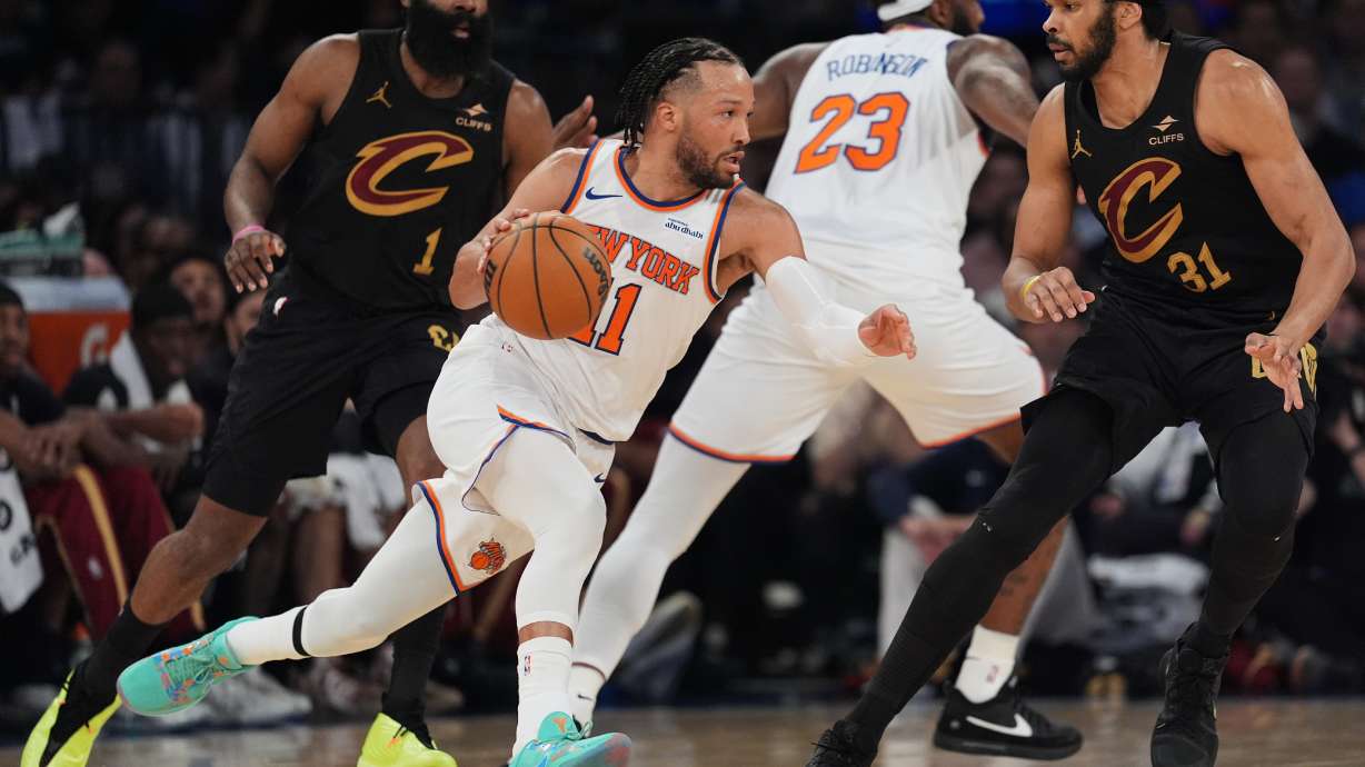 New York Knicks' Jalen Brunson (11) moves around the Cleveland Cavaliers defense during the first half of Game 1 in the Eastern Conference finals NBA basketball playoffs series Tuesday, May 19, 2026, in New York.