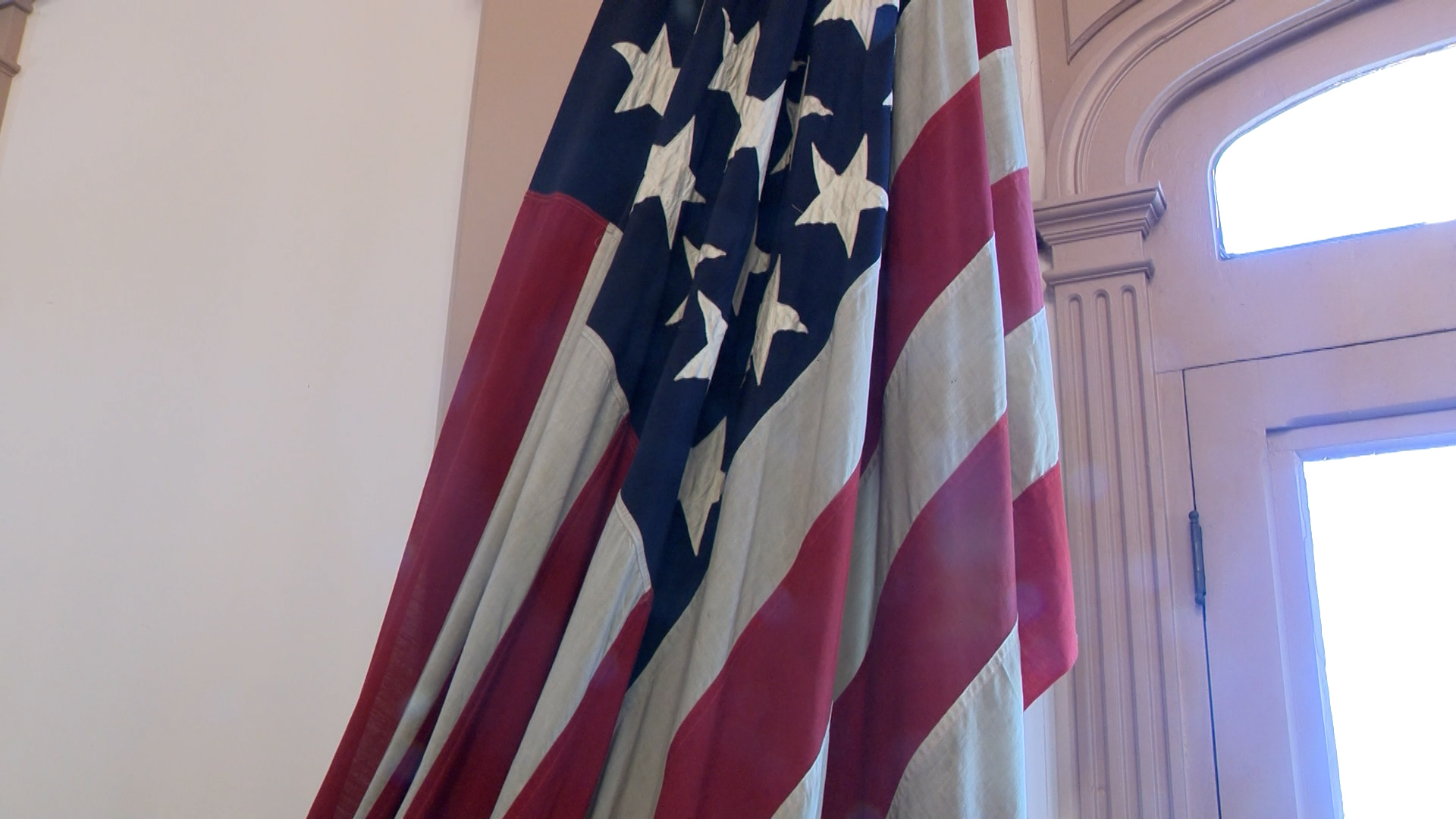 A flag from the USS Utah hangs in the Beaver County Courthouse, Tuesday. The flag was brought back by a Utah senator from Washington, D.C.