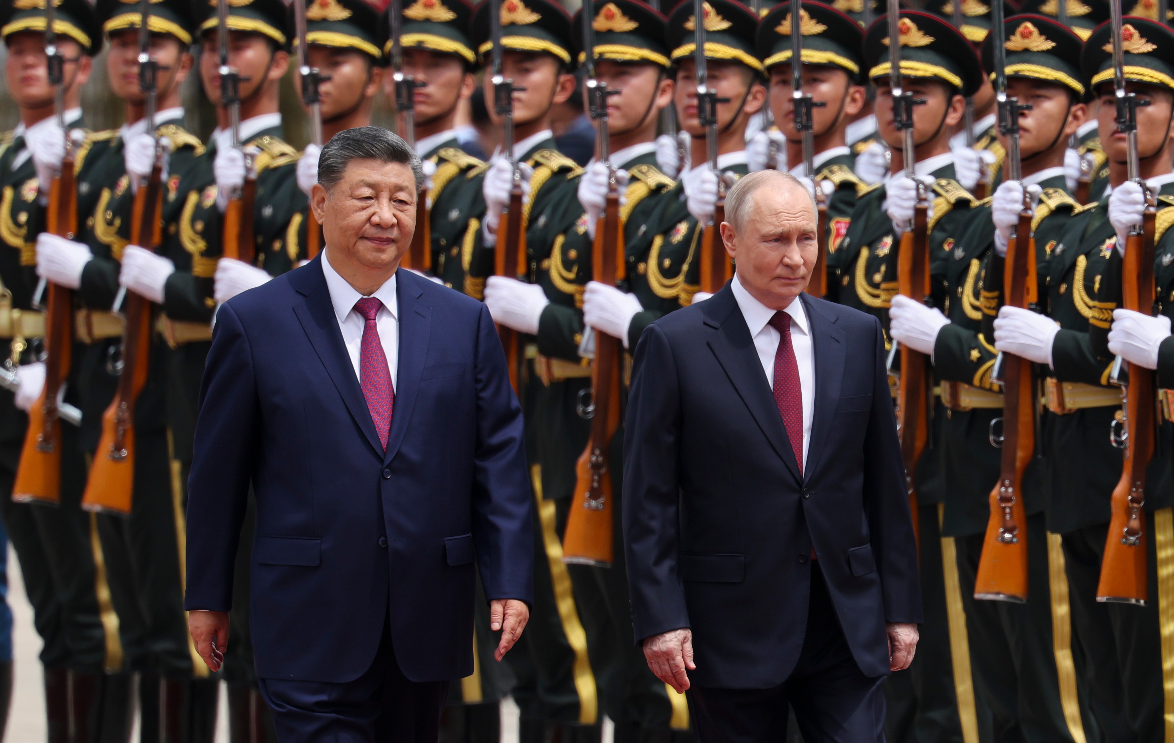 Putin and Xi hail their friendship and growing energy trade at their meeting in Beijing