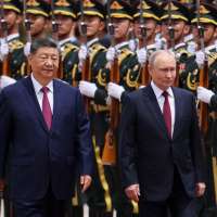 Putin and Xi hail their friendship and growing energy trade at their meeting in Beijing