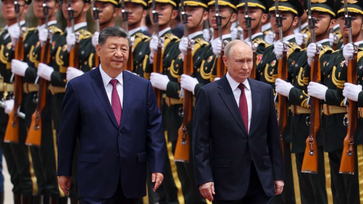 Russian President Vladimir Putin, right, and Chinese President Xi Jinping inspect an honor guard during a welcoming ceremony at the Great Hall of the People in Beijing on Wednesday.