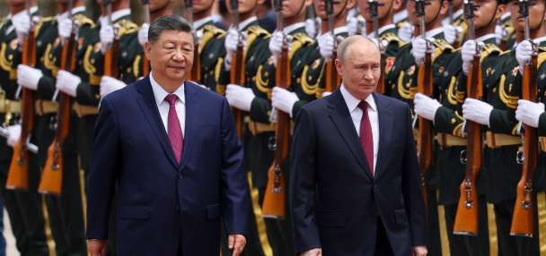 Putin and Xi hail their friendship and growing energy trade at their meeting in Beijing