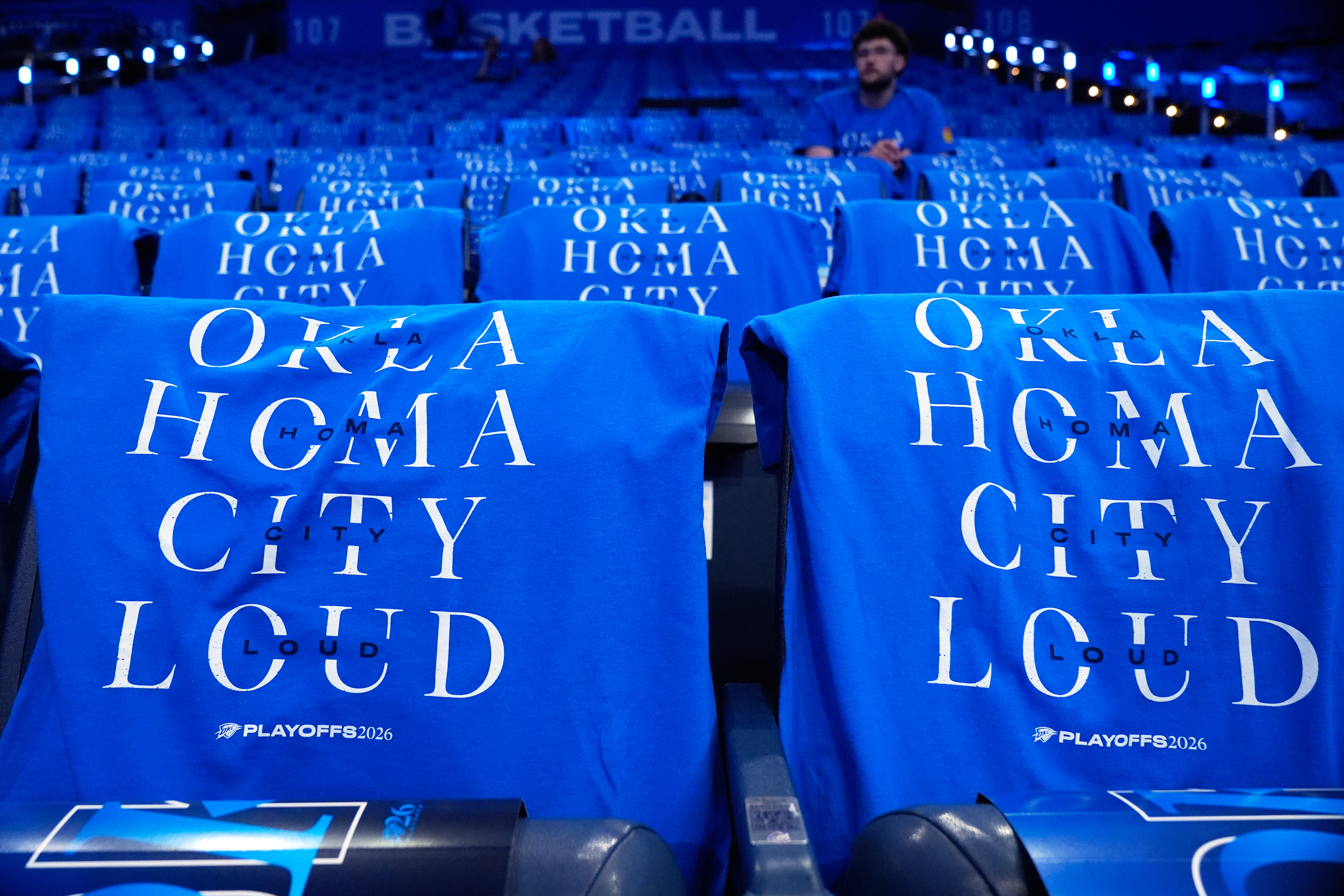 T-shirts are draped on fan seats before Game 1 in a third-round NBA basketball playoffs series between the San Antonio Spurs and the Oklahoma City Thunder Monday, May 18, 2026, in Oklahoma City. 