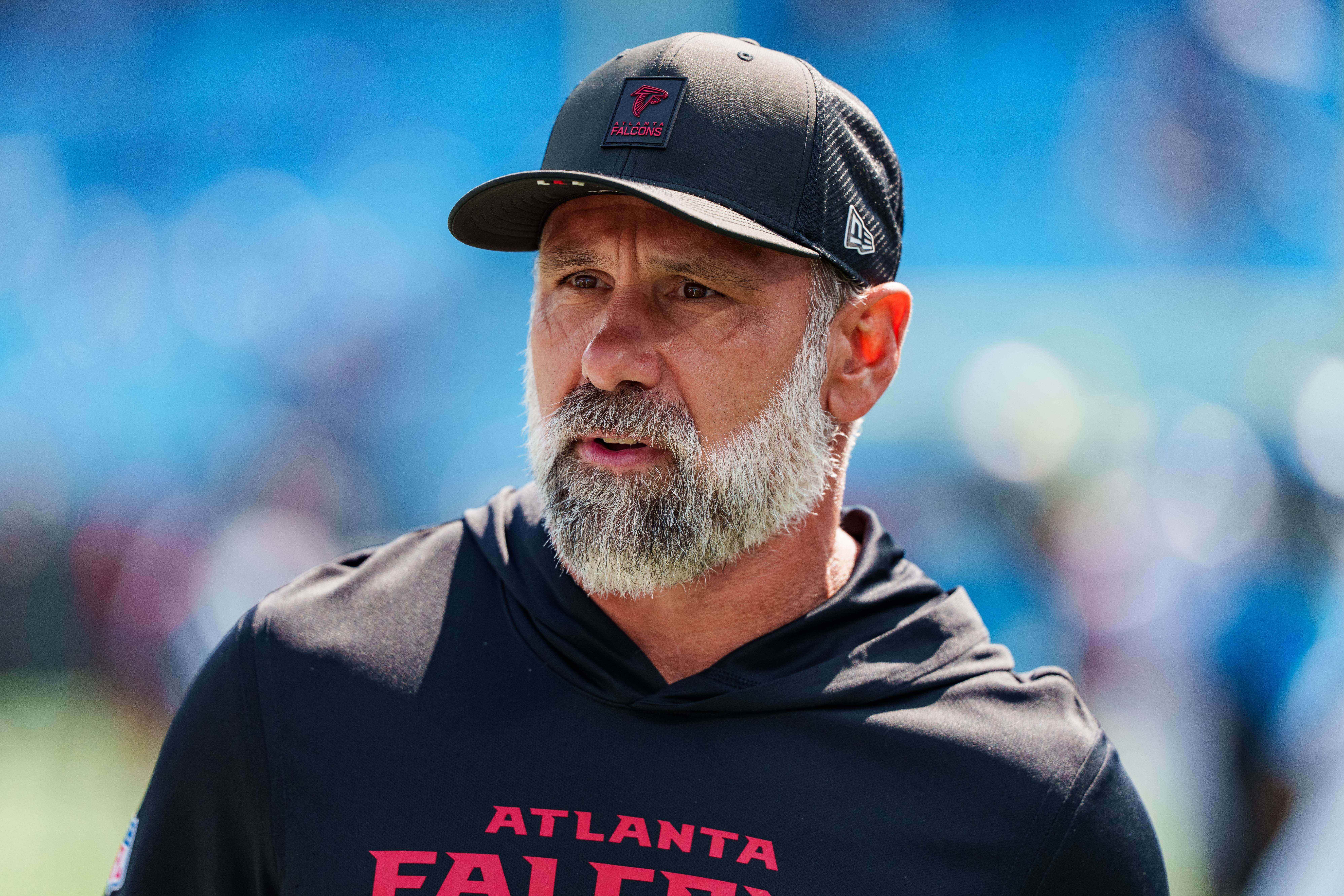 FILE - Atlanta Falcons defensive coordinator Jeff Ulbrich looks on before an NFL football game between the Carolina Panthers and the Atlanta Falcons, Sep. 21, 2025, in Charlotte, N.C.