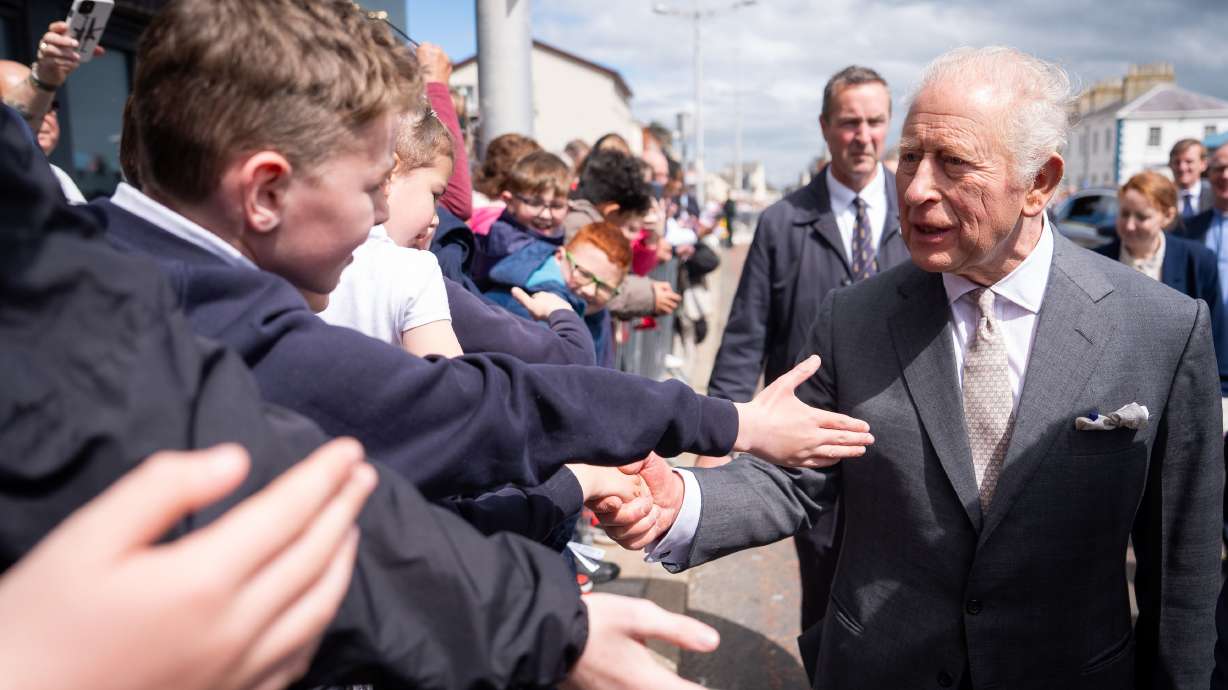 Britain's King Charles III meets well-wishers outside the Pantry Foodbank in Donard Methodist Church, in Newcastle, Northern Ireland, Wednesday. Charles also received a "lasting impression" from a seagull while visiting the country.