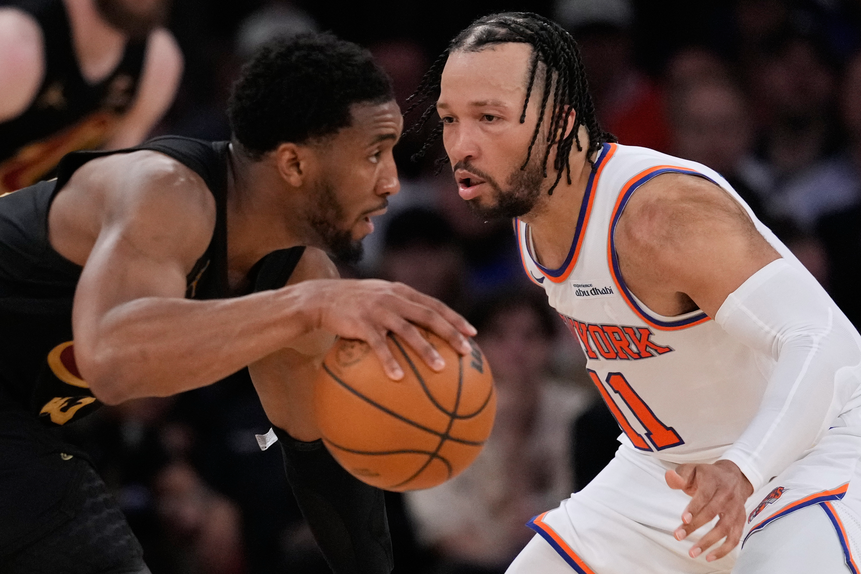 New York Knicks' Jalen Brunson, right, covers Cleveland Cavaliers' Donovan Mitchell, left, during the second half of Game 1 in the Eastern Conference finals NBA basketball playoffs series, Tuesday, May 19, 2026, in New York.