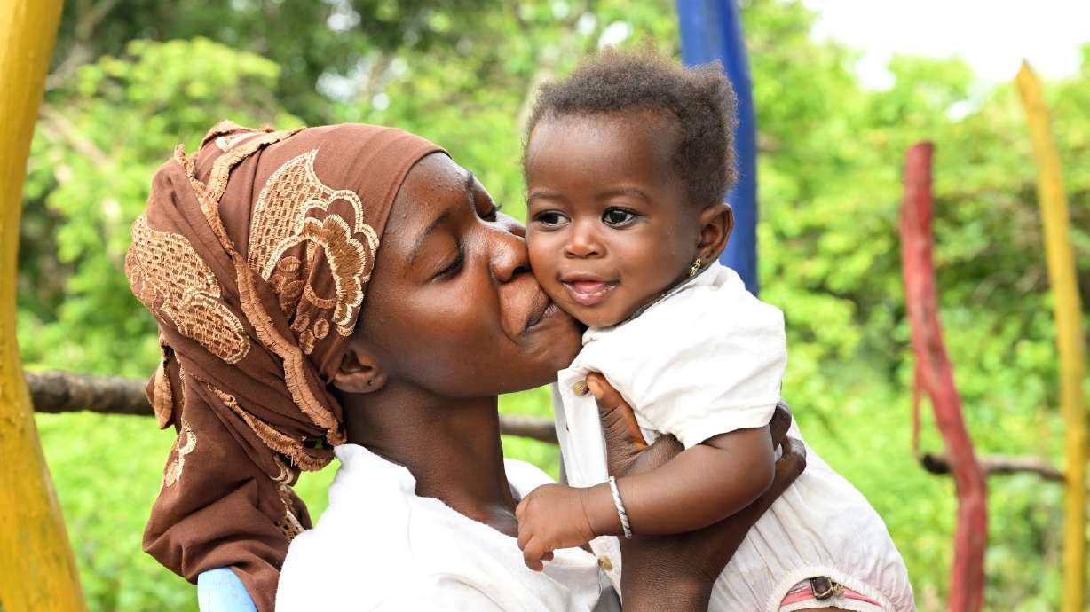 Laveille cuddles her 6-month-old baby, Korotoum, in Côte d’Ivoire. The Church of Jesus Christ of Latter-day Saints announced a $25 million donation to UNICEF on Wednesday to help with children's nutrition.