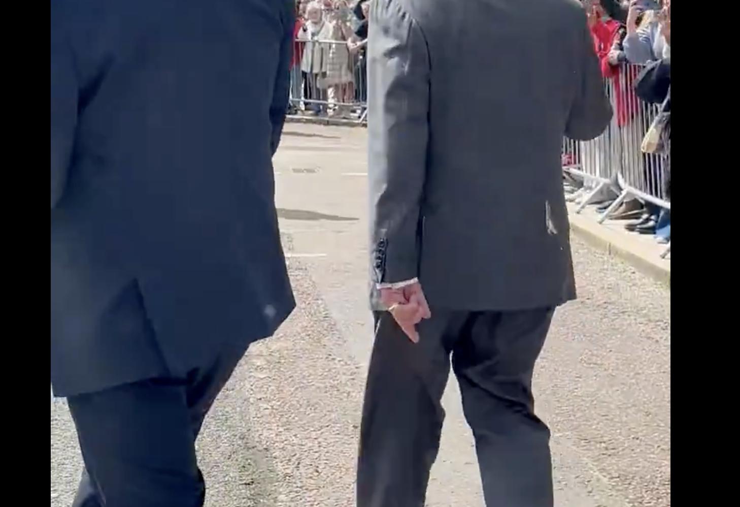 In this screenshot taken from social media video by the Daily Mail's Rebecca English, the remains of a seagull's "gift" to King Charles III, right, while visiting Northern Ireland, Wednesday. The king jokingly said he was lucky it didn't land on his head.