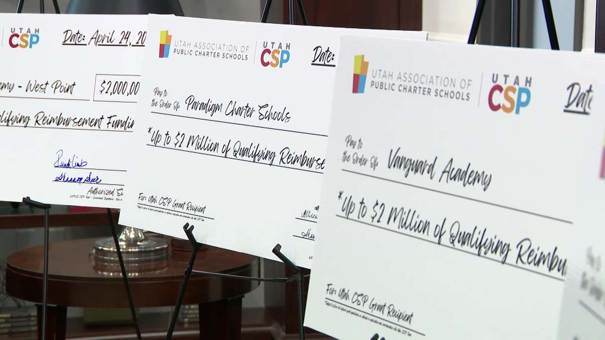 Federal grants awarded to four Utah charter schools are pictured, Tuesday. The four schools will receive up to $2 million to help expand learning opportunities for students statewide.