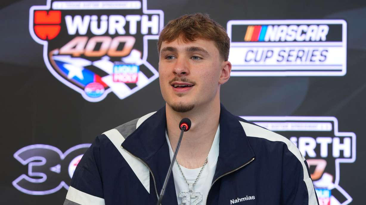 Dallas Mavericks forward Cooper Flagg answers a question before acting as honorary pace car driver for a NASCAR Cup Series auto race at Texas Motor Speedway in Fort Worth, Texas, Sunday, May 3, 2026.