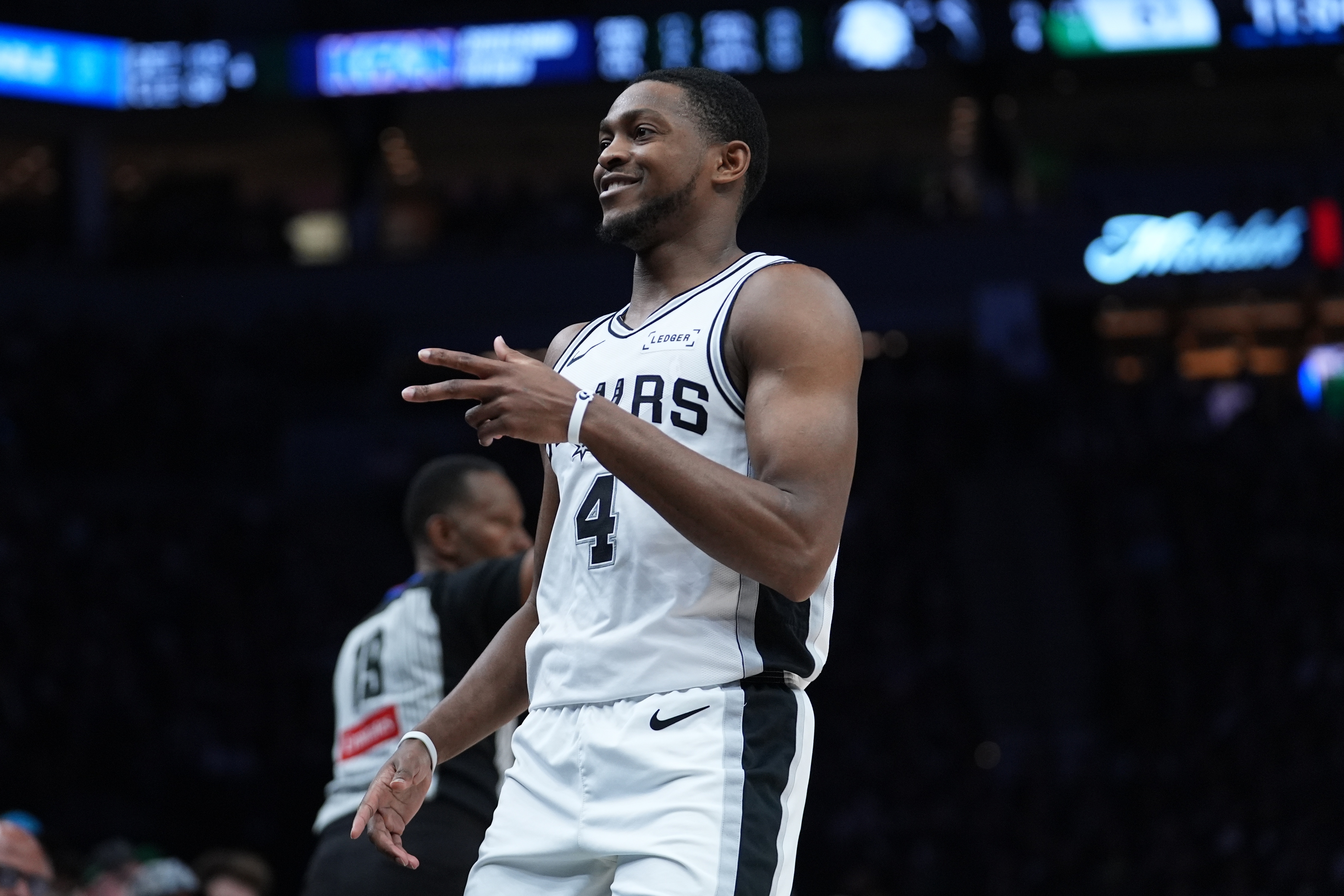 San Antonio Spurs guard De'aaron Fox (4) reacts after scoring against the Minnesota Timberwolves during the second half of Game 6 of an NBA basketball second-round playoffs series in Minneapolis, Friday, May 15, 2026. 
